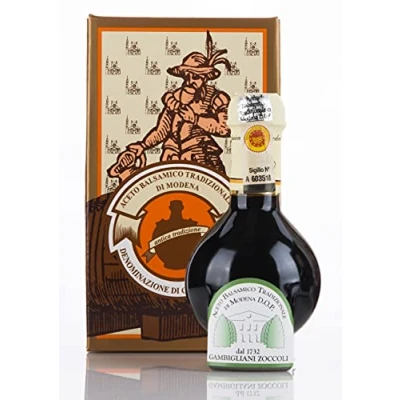 Afbeelding van ACETAIA GAMBIGLIANI ZOCCOLI TRADITIONELE BALSAMISCHE AZIJN van MODENA GECERTIFICEERD D.O.P. MINIMAAL 12 JAAR. Verpakt in de officiële doos het producentenconsortium Antiche Acetaie, met maatbeker en flyer