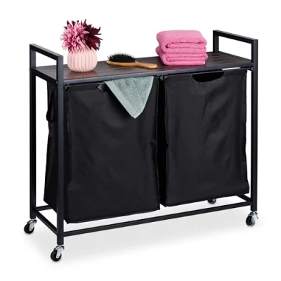 Afbeelding van Relaxdays dubbele wasmand, 2 uitschuifbare vakken, wassorteerder op wielen, industrieel design, met plank, zwart/bruin