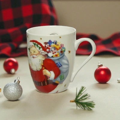 Afbeelding van Kerstmok van porselein met kerstman Witte mok in kerstsfeer