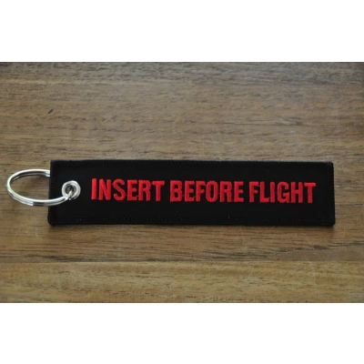 Afbeelding van INSERT BEFORE FLIGHT sleutelhanger