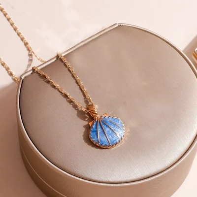 Afbeelding van ketting met hanger Schelp blauw goudkleur