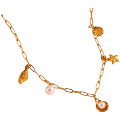 Afbeelding van Goudkleurige damesketting met schelp en parelbedels
