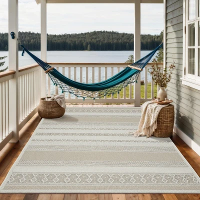 Afbeelding van Vloerkleed voor buiten of balkon en terras In beige 80 x 150 cm Tapijt geschikt Outdoor Rechthoekig Weer UV bestendig Tuintapijt Buitentapijt CALGARY kleed by The Carpet