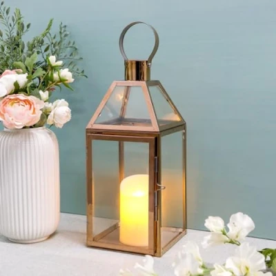 Afbeelding van JHY DESIGN Rose Gold decoratieve lantaarns 34 cm hoge roestvrijstalen kaarslantaarns met gehard glas. Voor binnen buiten, evenementen, feesten en bruiloften