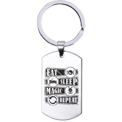 Afbeelding van Sleutelhanger RVS Eat Sleep Magic Repeat
