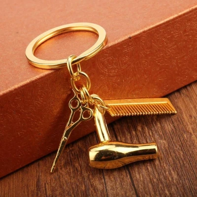Afbeelding van Sleutelhanger Kapsalon Goud Kapper Kam Fohn Schaar