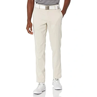 Afbeelding van Amazon Essentials Slim fit stretch golfbroek voor heren, lichtbeige, 36W/29L