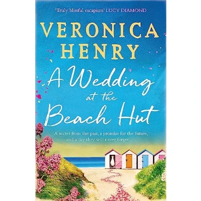 Afbeelding van A Wedding at the Beach Hut feelgood read of summer from Sunday Times topten bestselling author