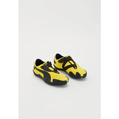 Afbeelding van PUMA Mostro OG Prime Sneakers Unisex, Zwart/Geel, Maat 35,5