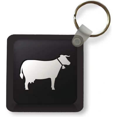 Afbeelding van Sleutelhanger een illustratie van koe op zwarte achtergrond Plastic Rond Uitdeelcadeautjes