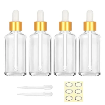 Afbeelding van Apstaqeoo 4 stuks 50 ml heldere glazen druppelflesjes lege fles met druppelaar pipet navulbare monsterfles tinctuur gouden dop voor etherische oliën aromatherapie parfums