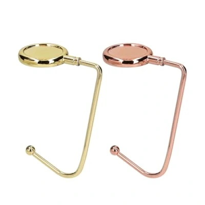 Afbeelding van kwmobile Tassenhaken voor tafel Set van 2 draagbare tashangers Tassenhangers of kast In goud / koper