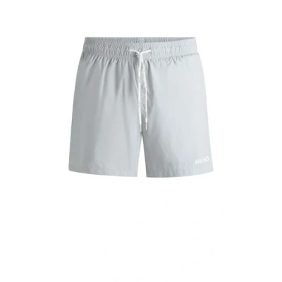 Afbeelding van HUGO BOSS heren Haiti zwemshorts met logo in de kleur Lichtgrijs, maat: L
