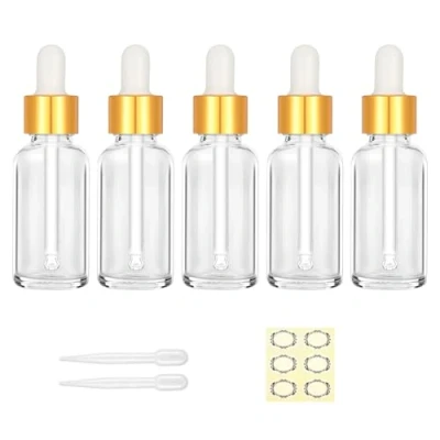Afbeelding van Apstaqeoo 5 stuks 30 ml transparante glazen druppelflesjes met pipet, navulbare oogdruppelflesjes lege tinctuurflessen gouden dop, label, druppelaar voor etherische oliën parfum