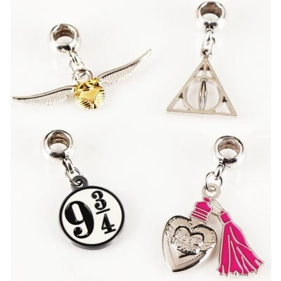 Afbeelding van The Carat Shop Harry Potter Golden Snitch Deathly Hallows Love Potion Platform 9 3/4 Bedelset
