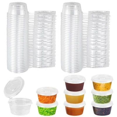 Afbeelding van SLTAXAR 100 stuks bewaardozen met deksels kleine 2oz voedselbewaardozen Lekvrije sausbekers 50ml plastic bakjes Dressingbekers Magnetronbestendige voor sauzen, dips en kruiden