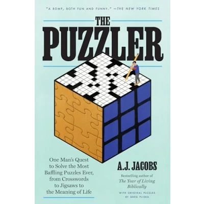 Afbeelding van the Puzzler: One Man&#039;s Quest to Solve Most Baffling Puzzles Ever, from Crosswords Jigsaws Meaning of Life