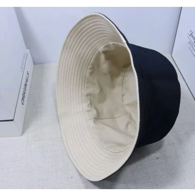 Afbeelding van Reversible bucket hat Maat S/M Donkerblauw &amp; Beige