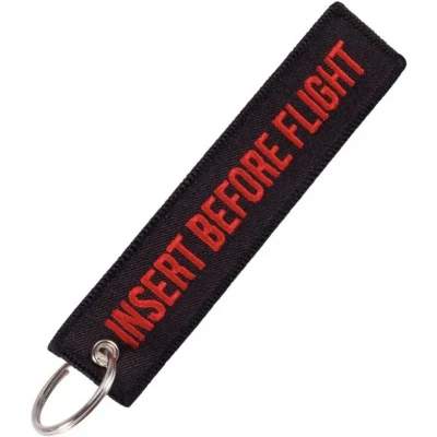 Afbeelding van Motorsleutelhanger Keychain INSERT BEFORE FLIGHT Sleutelhanger Zwart/Rood