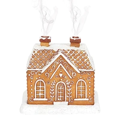 Afbeelding van Kerstregels met peperkoek huis wierook kegelbrander feestelijke woondecoratie voor een vrolijke herinnering, verspreid gejuich
