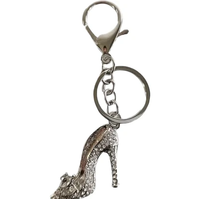 Afbeelding van Sleutelhanger Hak met strik Strass (Zilverkleurig) 11.5 x 4 cm
