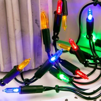 Afbeelding van Hellum 833577 Lichtketting 35 Pisellokaarsen kleurrijk/8,1 m/binnen/toevoerleiding 2 x 1,5 m groen