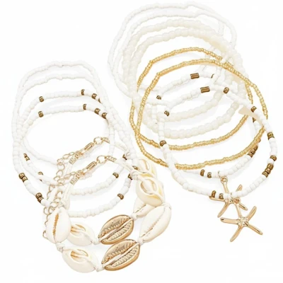 Afbeelding van Set van 14 zomerse schelpen armbanden voor dames met kralen en goudkleurige bedels boho sieradenset zeesterren