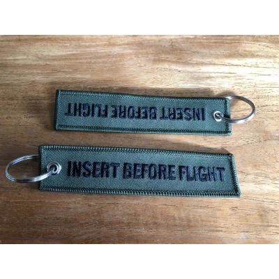 Afbeelding van INSERT BEFORE FLIGHT sleutelhanger