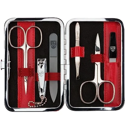 Afbeelding van DREI SCHWERTER Germany 6 delige manicureset &#039;Genova&#039; nagelverzorgingsset in rood kunstlederen etui Inhoud: nagelschaar, huidschaar, nagelknipper, glazen nagelvijl, pincet, saffier nagelvijl