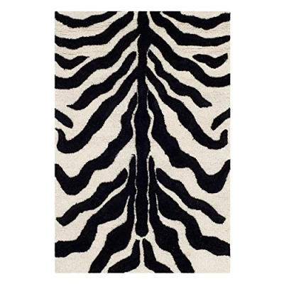 Afbeelding van SAFAVIEH Zebra tapijt voor woonkamer, eetkamer, slaapkamer Cambridge Collection, laagpolig, in ivoor en zwart, 76 x 244 cm