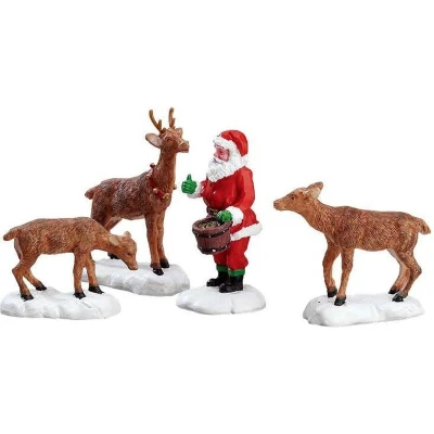 Afbeelding van Santa feeds reindeer LEMAX