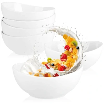 Afbeelding van COM FOUR® 6x keramische kommen 500ml ontbijtgranenkommen dessertkommen saladekommen ideaal voor ontbijt, snacks en desserts stijlvol design stapelbaar (6 stuks wit gebogen)