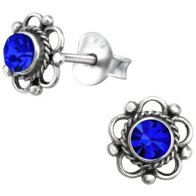 Afbeelding van JoyS Zilveren Bali bloem oorbellen 7 mm blauw kristal geoxideerd