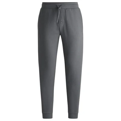 Afbeelding van HUGO BOSS heren Austin pyjamabroek met steekzakken in de kleur Grijs, maat: M