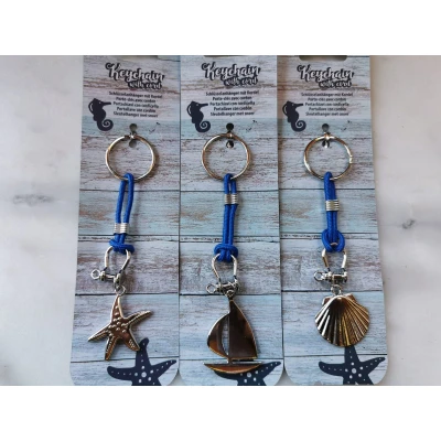 Afbeelding van Set van 3 sleutelhangers maritiem met blauw koord: Zeester, schelp en zeilboot
