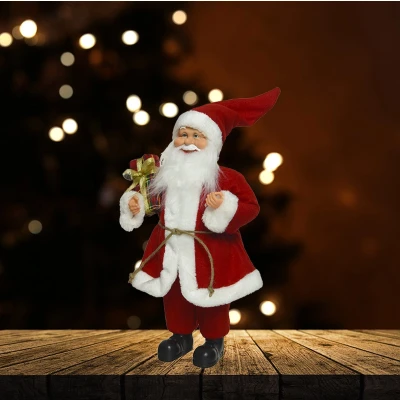 Afbeelding van Polyester kerstman met cadeau 30CM