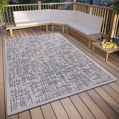 Afbeelding van Binnen en buitenkleed Telu 155x235 cm Beige 123vloerkleed.nl is de online webshop voor vloerkleden woonaccessoires.
