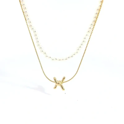 Afbeelding van Dubbele gouden ketting met parelmoer kraaltjes en prikkeldraad detail